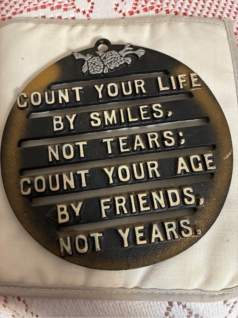 Vintage Black Cast Iron Trivet 3 footed “Count your life by Smiles…”